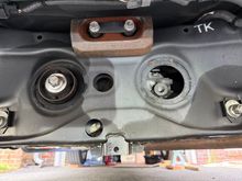 Looking under the rear of the vehicle towards the front end. 