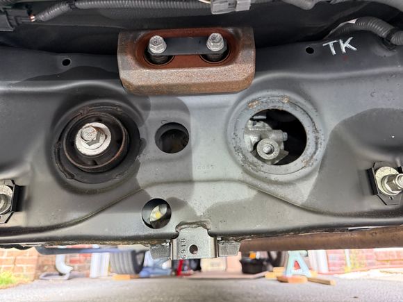 Looking under the rear of the vehicle towards the front end. 