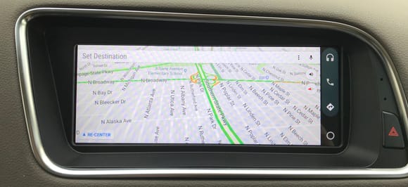 Android Auto app displaying Google Maps in driving mode.