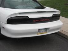 Painted black tail panel with red lettering. Spray tint taillights and third brake light. Next is cat back then headers.