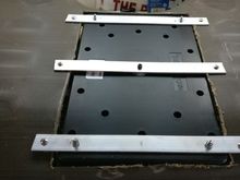 I then lay the subwoofer with supports into the back of the back seat and drilled mounting holes in the aluminum and the seat back.
