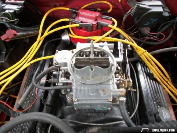 The engine is out os a 94-95 truck. I switched it from TBI to carb. It was an easy job. All I did was drill out the 4 center bolt holes 2 on each side in the center on the intake and hand milled them flat you cant even tell it was done.