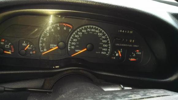 Gauges showing mileage upon purchase.