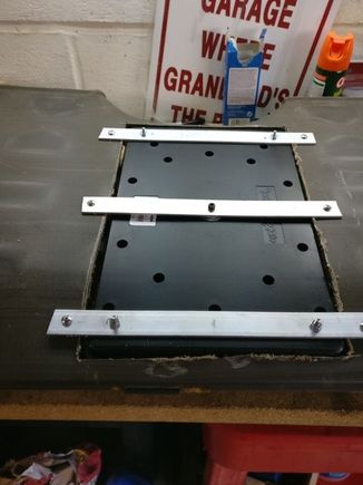 I then lay the subwoofer with supports into the back of the back seat and drilled mounting holes in the aluminum and the seat back.