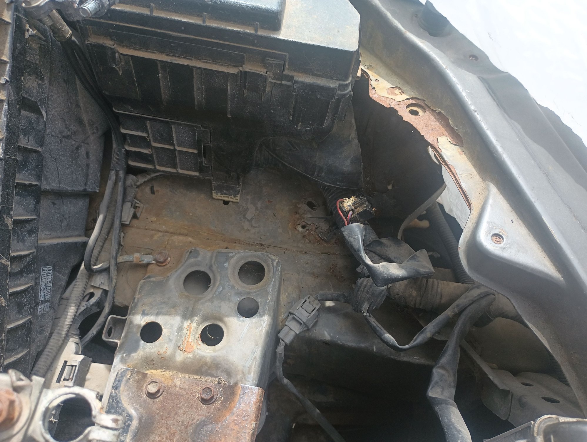 Possible nozzle for the tank next to battery (removed) under fuses
