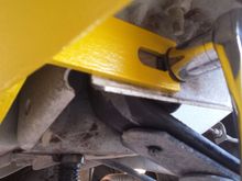 Slip the Y over the shaft and under the bolt head...