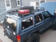 Jerry Can, HI-Lift, Axe, Spare on Roof Rack.