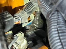 It’s the driver side rear of the head just outside the valve cover near the firewall. 