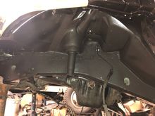 I top-coated the outsides of the frame rails and wheel wells with POR-15 Top Coat and 3M Rubberized Undercoating. 