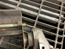 Use the nut as a guide to cut the bolt square.