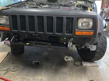 This Jeep had been involved in a head on type accident so fitting the mount was a challenge. After a bit of hammering, tweaking and cussing it fit 👍. The mount actually realigned  the frame area close to factory spec.