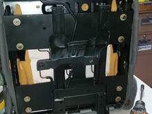 Passenger seat bracket bolted up. 2" offset off center, 1" back from center give or take. Moved away from the transmission tunnel for fit.