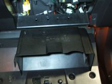 3.  Let glove box rest on its hinges
