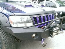 here is the companies pick of the front I have sqaure light cut outs but no brush guard.
