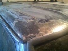 Pitted grey metal. Spots all over the roof.