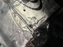 Drilling up through the trunk floor 