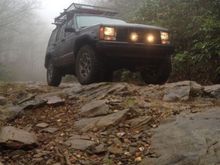 foggy mountain top

1993 Jeep cherokee with Bushwacker cutout fenders, 3" lift, 1" spidertrax adapters, rubicon wheels, yakima roof rack, rotopax mounts, hela lights