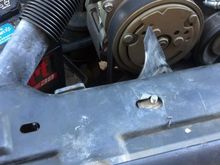 Because everything sits slightly off-center and is slightly bent underneath, the plate that goes on top of the radiator didn't go back on once we unscrewed it and took it off.  New holes needed to be drilled to get it back on right.  Washers were used with the bolts to get it back on.