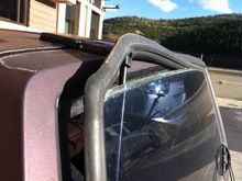 Hatch strut pops off and it went right through the rear window gasket. Awesome...............