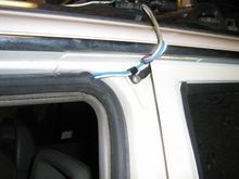 I sneak my dual 12ga feed wires thru the door weatherstrip and ground heavy 10ga (both sides) to the B pillar.IMG 2473