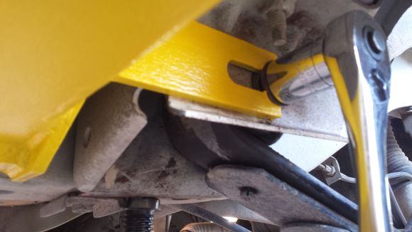 Slip the Y over the shaft and under the bolt head...