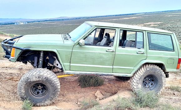 I run this thing in rocks trees willows these rails have kept the jeep looking decent. The 3/16 is denting and gougeing from rocks but makes hard stuff easy because i just slide over rocks and pivot off them around trees.
The fenders just cover 35x12.5 on 3.75 bs 15x8 wheels.

It would be some kinda bad dream to go back to wherling without fenders and sliders.  Nearly un bearable in wet conditions 