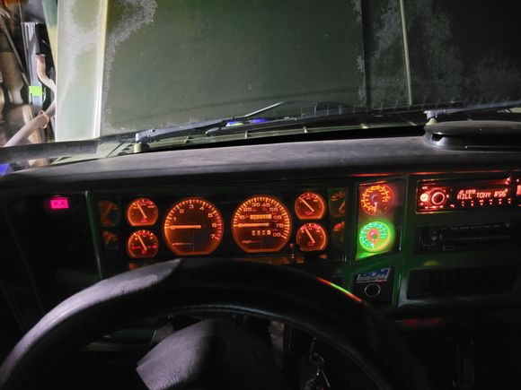 I fit two in the blank panel. Had to make a smoked cover for them since the gauges dont dim. 