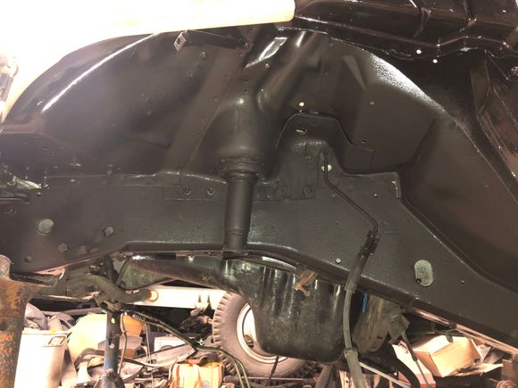 I top-coated the outsides of the frame rails and wheel wells with POR-15 Top Coat and 3M Rubberized Undercoating. 