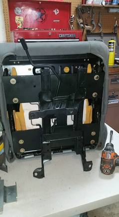 Passenger seat bracket bolted up. 2" offset off center, 1" back from center give or take. Moved away from the transmission tunnel for fit.