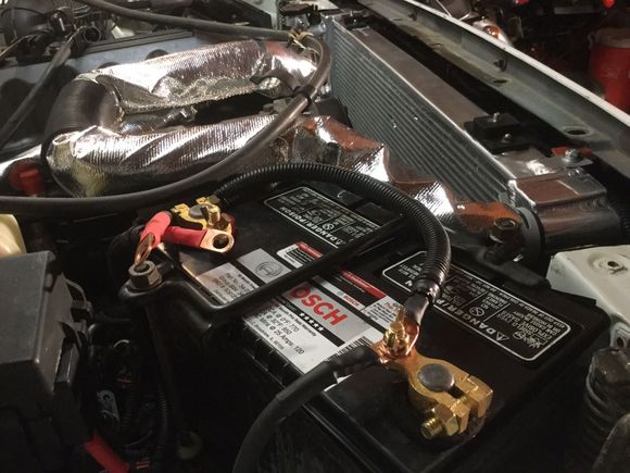 Hoses on,battery with new clamps,wires & sleeve on.