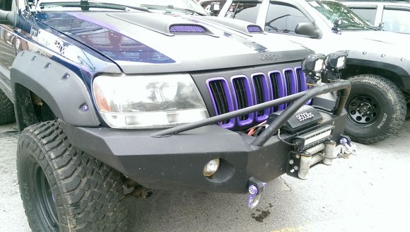 here is the companies pick of the front I have sqaure light cut outs but no brush guard.
