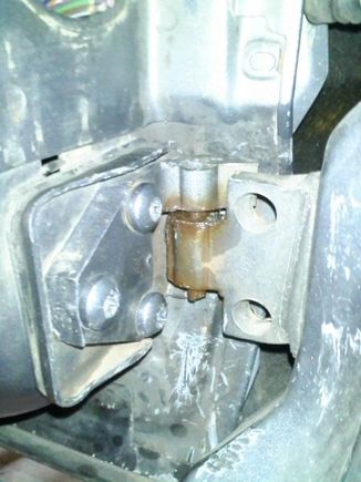 Lower hinge after cutting, aligning and re-installation.