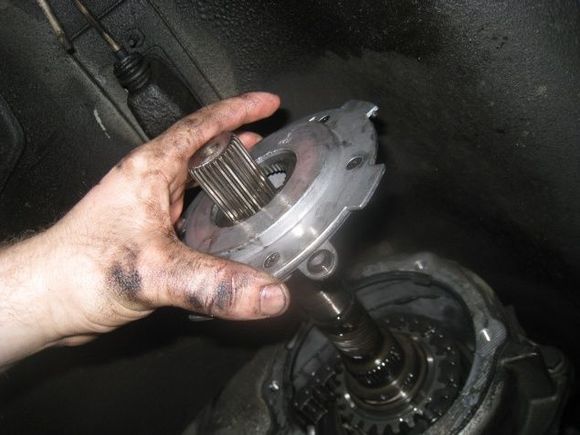 should slip right off the shaft, be careful though as the middle will move around