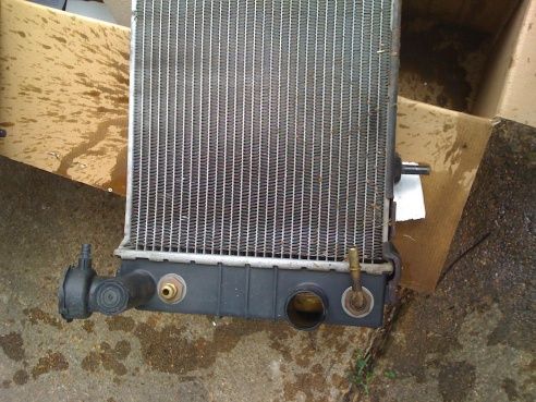 Plastic tank on original rad with screw-in fitting for trans cooler