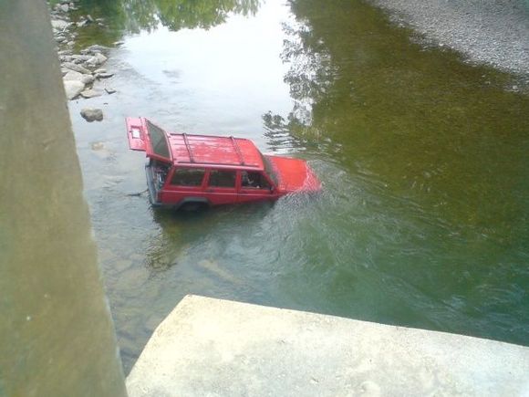 Did I mention I hate water? As it flowed threw my whole vehicle at one time. By the way I pulled it out let the plugs dry and cleaned them, and the next day it fired right up... Only in a jeep