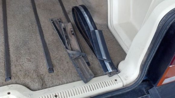 The formerly attached trim pieces.  They really needed no extra help to come off except for the long one from the passenger side front door.  The rest were beginning to peel off anyway.