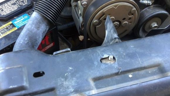Because everything sits slightly off-center and is slightly bent underneath, the plate that goes on top of the radiator didn't go back on once we unscrewed it and took it off.  New holes needed to be drilled to get it back on right.  Washers were used with the bolts to get it back on.