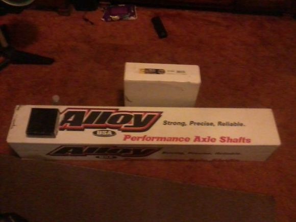 Axle shaft, bearing kit, and brake drum