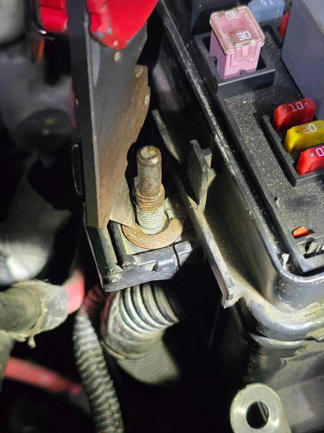 If you zoom in on this photo you can see its cracked at that part that goes around the stud. Almost as if the terminal is broke in half. 