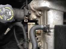 Just between the air cleaner stud and the valve cover