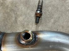 Here is tge O2 sensor with a light coat of copper never seize ready to go into the new converter pipe. 