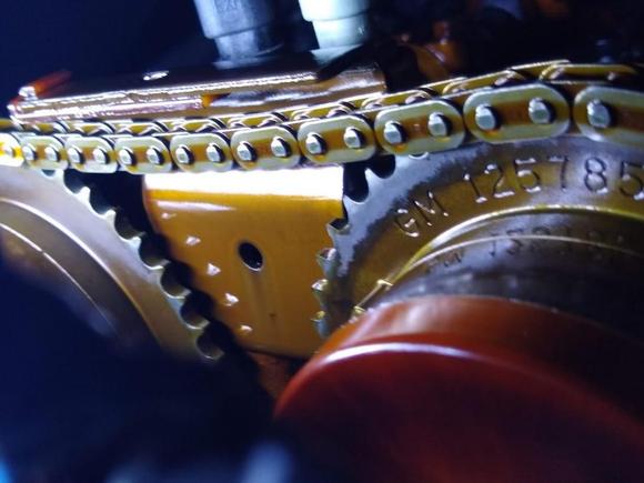 This is an example of a loose chain slapping against that upper guide, weakening the top plate and snapping it off. 