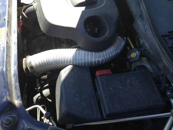 I added a 3” flexable aluminum dryer hose to the bottom driver side of the lower air box , it connects to a shop vac  nozzle tucked under the radiator support plastic 