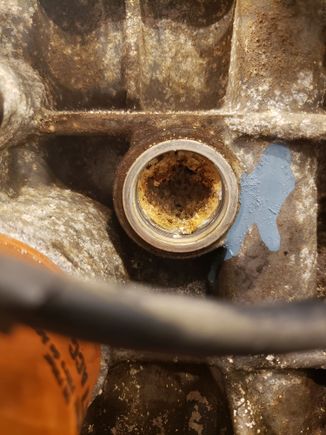 This is the block drain plug hole. Looked like there was a good half inch of buildup on the bottom of the water jacket.