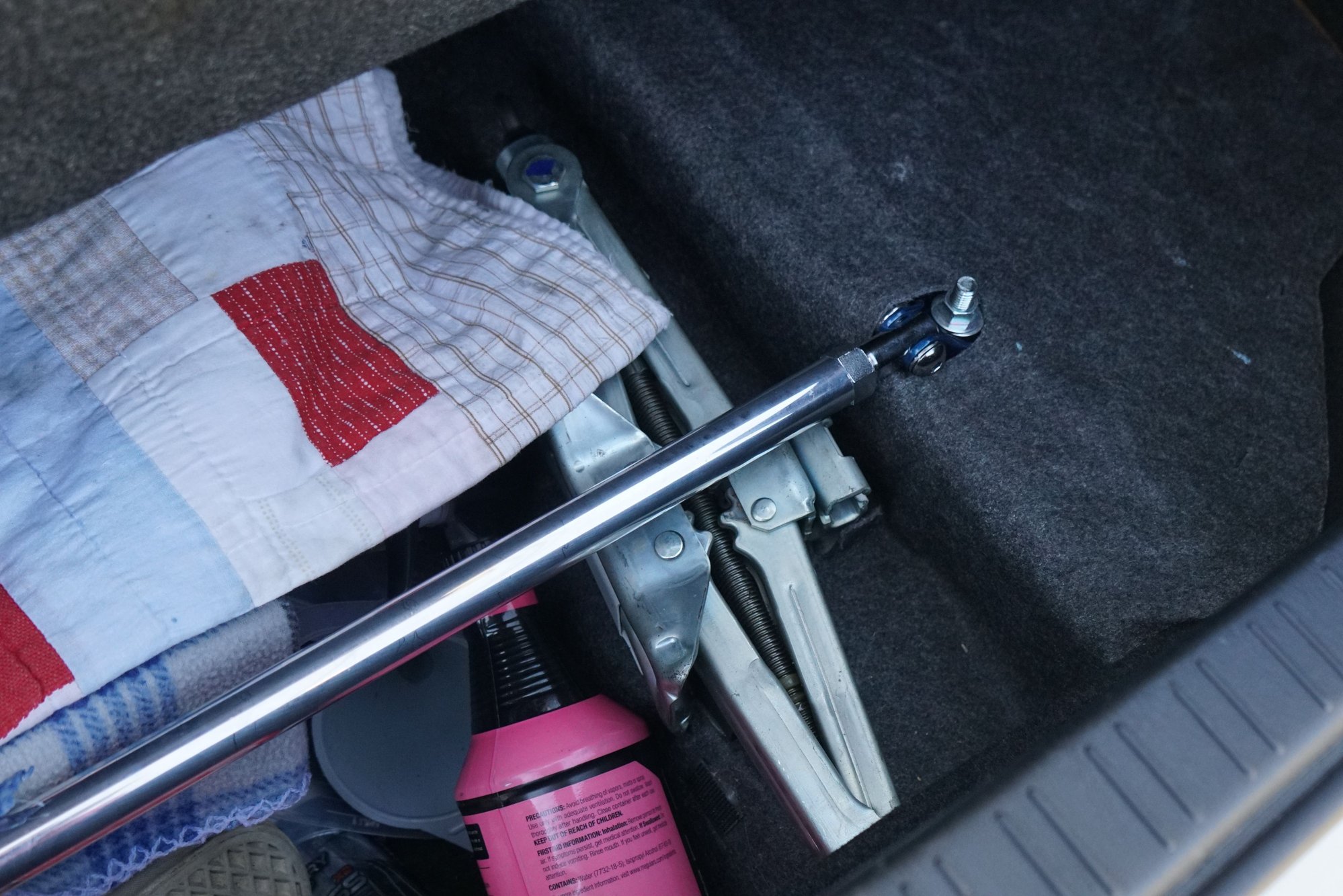Passengers side mounting of the trunk bar. Used OEM holes to mount.