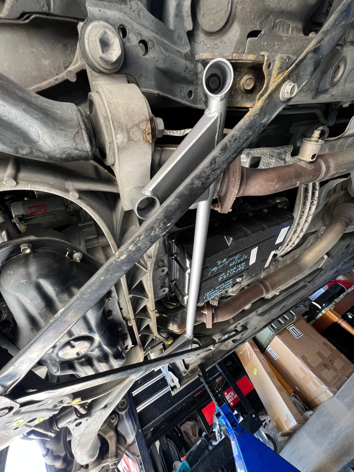 Based off the instructions, you will need to mount the brace to one of the LCA #2 Bracket bolt and  this other bolt as shown. 