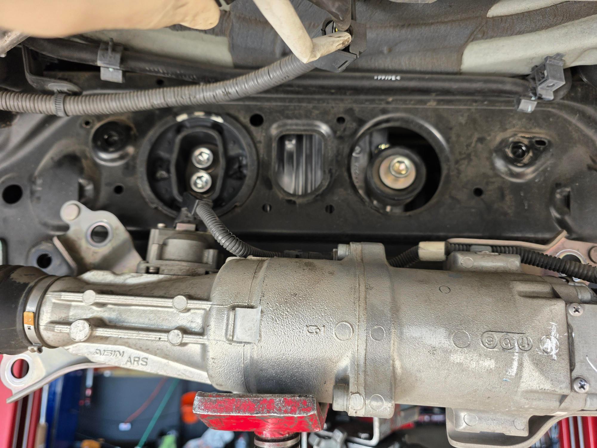 11A. New bushing install on left side (replaced the old one just while we were in there).