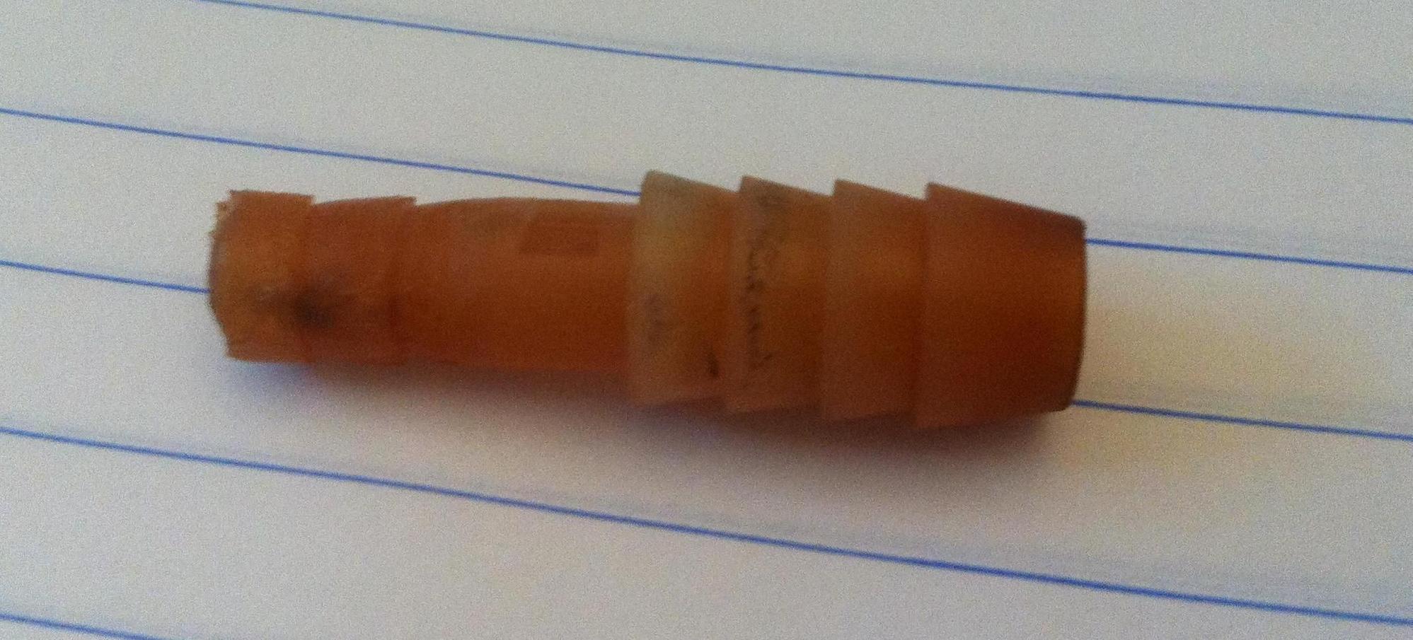 Radiator coolant filler neck leak is this coupling a factory part