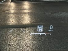 HUD @ 50% brightness. This is actually well visible. Pictures shows somewhat of a worse case scenario where substantial glare is reflecting off the pavement.