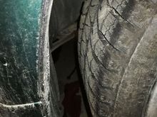 The mount where the rust occurred is seen behind the tire. 